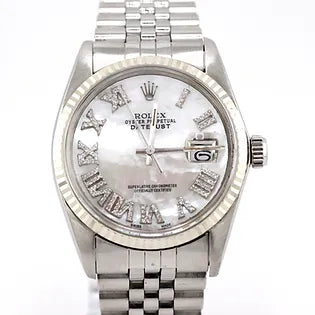 A pre-loved steel wristwatch with a diamond-set dial and bracelet